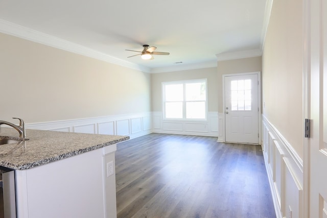 65 Hood Park Ct, Jasper, GA 30143 - unfurnished dining area with a decorative wall, a ceiling fan, a wainscoted wall, a sink, and crown molding