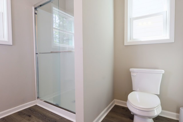 65 Hood Park Ct, Jasper, GA 30143 - bathroom with a shower stall, wood finished floors, toilet, and baseboards