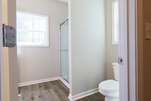 65 Hood Park Ct, Jasper, GA 30143 - bathroom featuring wood finished floors, toilet, a shower stall, and baseboards