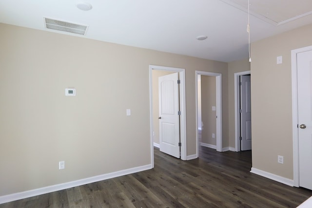 65 Hood Park Ct, Jasper, GA 30143 - spare room featuring attic access, dark wood-style flooring, and baseboards
