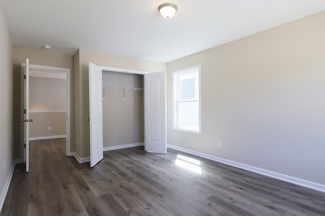 65 Hood Park Ct, Jasper, GA 30143 - unfurnished bedroom with dark wood-style flooring, baseboards, and a closet