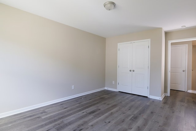 65 Hood Park Ct, Jasper, GA 30143 - unfurnished bedroom featuring wood finished floors, baseboards, and a closet