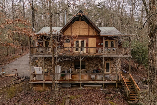 rear view of property with a deck