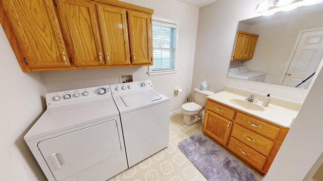 laundry room featuring sink and independent washer and dryer