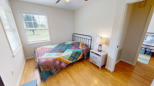 bedroom featuring light wood-type flooring and ceiling fan