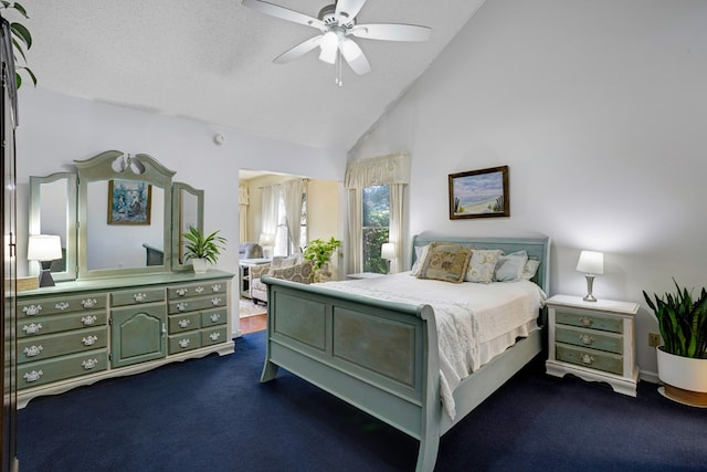 bedroom with ceiling fan, high vaulted ceiling, a textured ceiling, and dark colored carpet