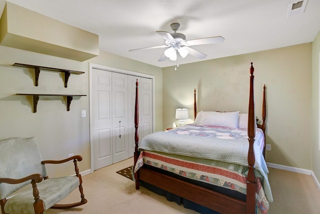 carpeted bedroom with a closet and ceiling fan