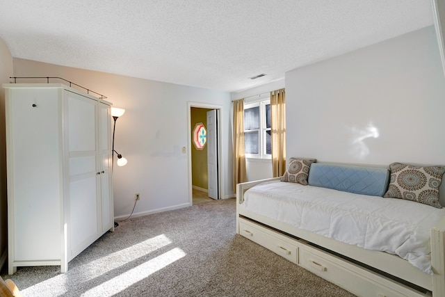 14 Rivendell Dr, Hayesville, NC 28904 - bedroom with light carpet, a textured ceiling, and baseboards