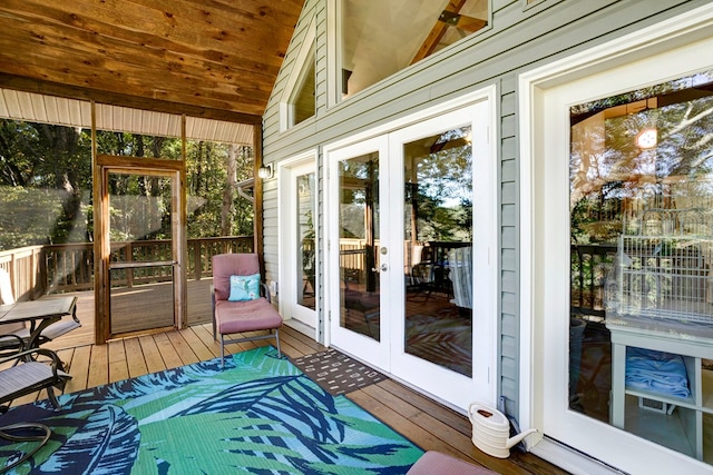 sunroom / solarium with french doors and lofted ceiling