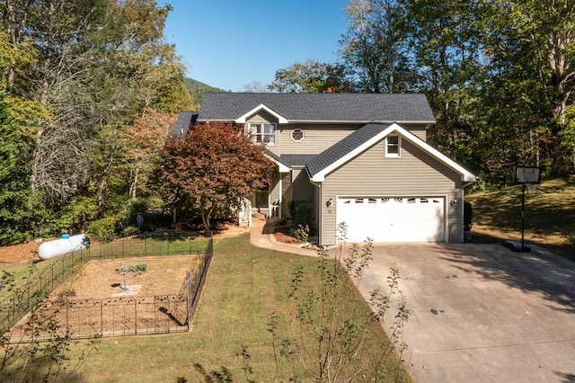 view of front of property featuring a front yard and a garage