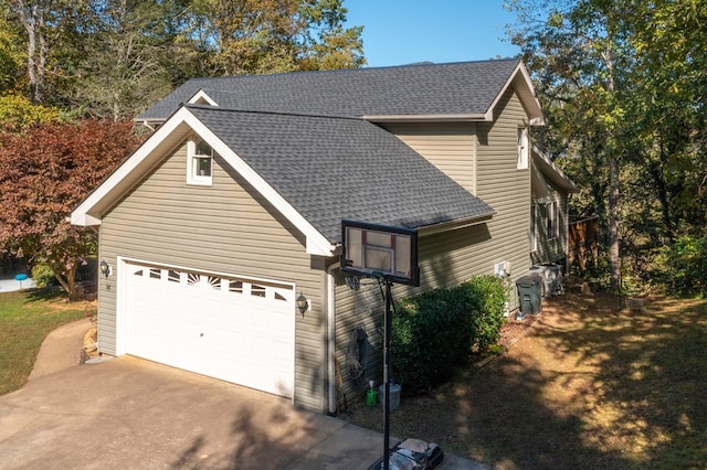 14 Rivendell Dr, Hayesville, NC 28904 - view of side of home with concrete driveway, a shingled roof, and an attached garage