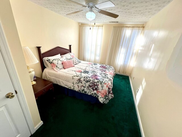 75 Briar Patch Dr, Covington, GA 30014 - carpeted bedroom featuring ceiling fan and a textured ceiling