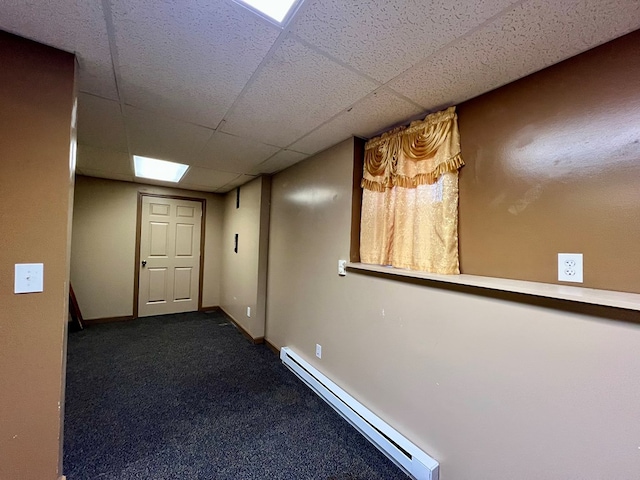 75 Briar Patch Dr, Covington, GA 30014 - hall with dark colored carpet, a drop ceiling, and a baseboard radiator