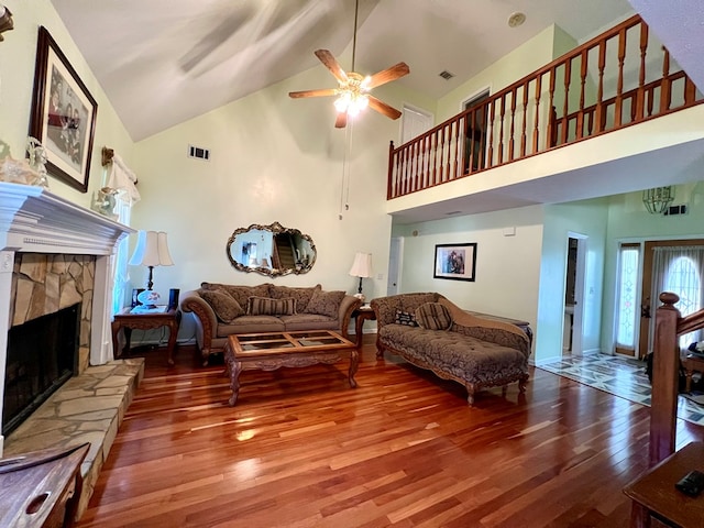 75 Briar Patch Dr, Covington, GA 30014 - living room featuring a fireplace, hardwood / wood-style floors, high vaulted ceiling, and ceiling fan