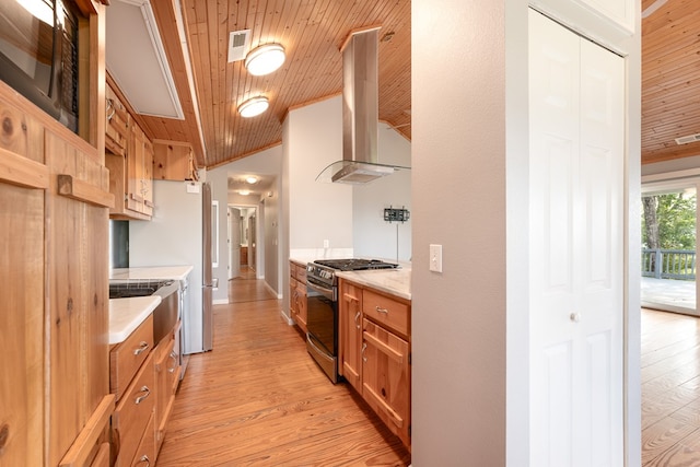 330 Ravens Gap Rd, Murphy, NC 28906 - kitchen featuring stainless steel gas stove, wall chimney range hood, wood ceiling, vaulted ceiling, and light countertops
