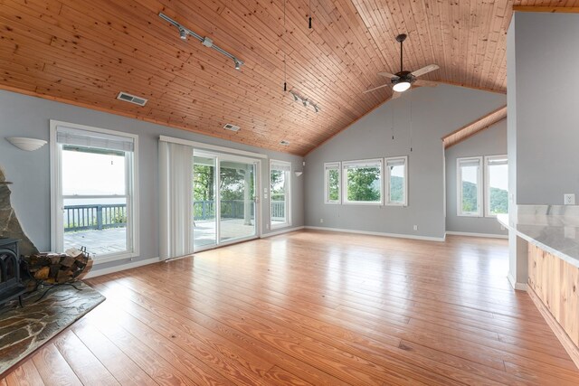 330 Ravens Gap Rd, Murphy, NC 28906 - living room with high vaulted ceiling, a wood stove, ceiling fan, rail lighting, and light wood-type flooring