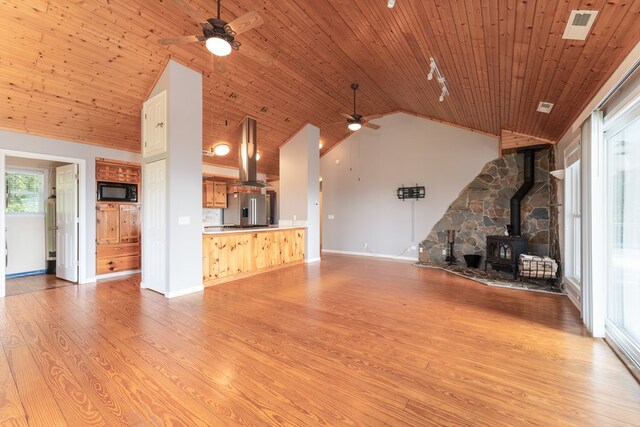 330 Ravens Gap Rd, Murphy, NC 28906 - unfurnished living room with ceiling fan, a wood stove, light wood finished floors, wood ceiling, and high vaulted ceiling
