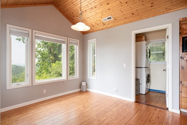 330 Ravens Gap Rd, Murphy, NC 28906 - spare room with stacked washing machine and dryer, wood ceiling, light wood-style flooring, and lofted ceiling
