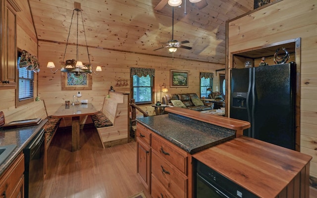 kitchen featuring black fridge, wooden ceiling, brown cabinets, light wood-style floors, and dishwashing machine