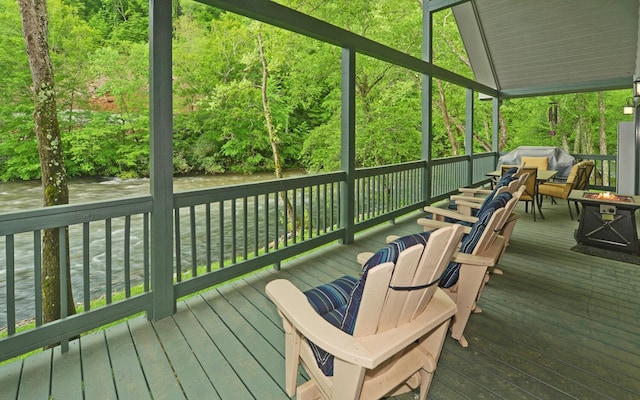 wooden terrace with an outdoor fire pit