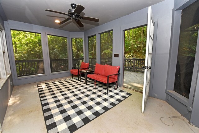 sunroom with plenty of natural light and ceiling fan