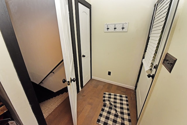 corridor featuring dark hardwood / wood-style flooring