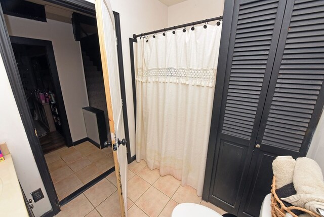 bathroom with tile patterned floors