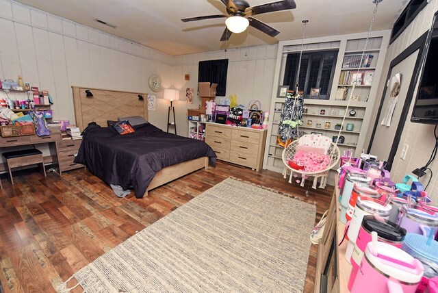 bedroom featuring ceiling fan and dark hardwood / wood-style flooring