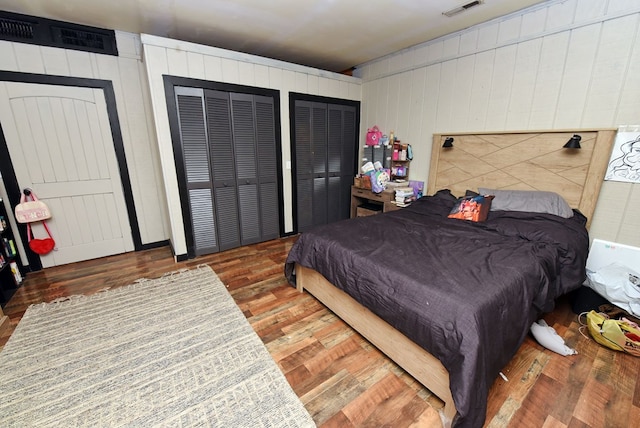 bedroom with hardwood / wood-style floors