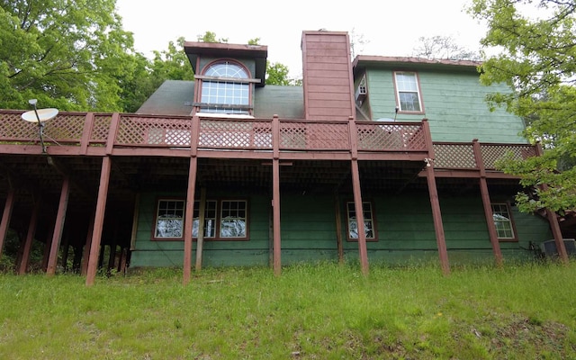 rear view of house featuring a deck