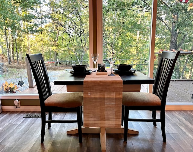 dining room with hardwood / wood-style flooring