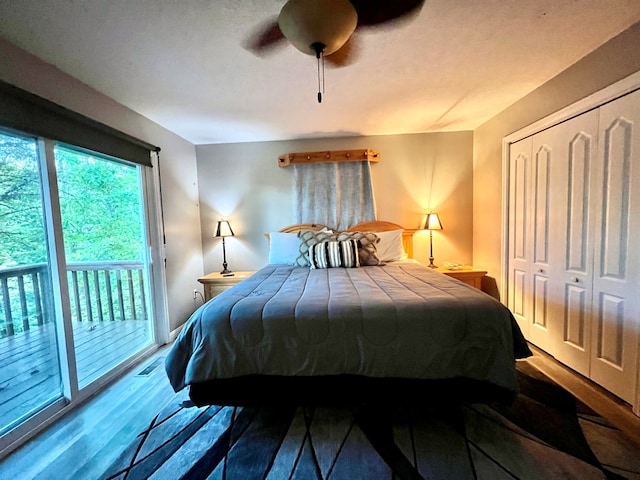 bedroom featuring hardwood / wood-style floors, access to exterior, a closet, and ceiling fan