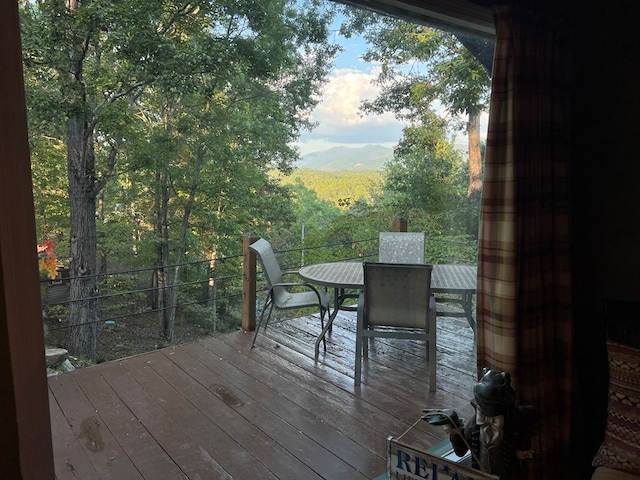 wooden deck featuring a mountain view