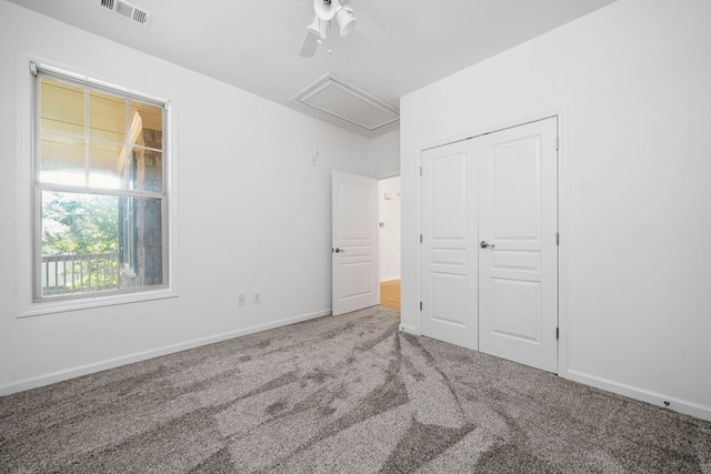 238 Balsam Dr, Canton, GA 30114 - unfurnished bedroom featuring attic access, carpet, a closet, and a ceiling fan