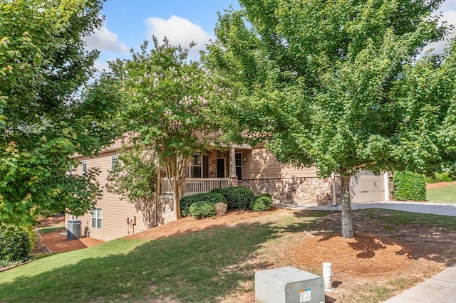 238 Balsam Dr, Canton, GA 30114 - obstructed view of property featuring stone siding, covered porch, driveway, and a front yard