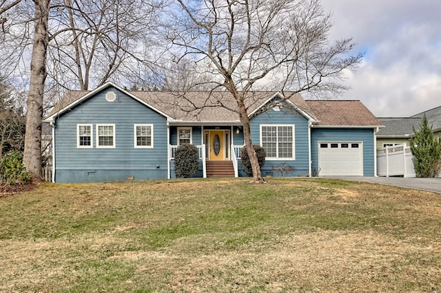 ranch-style home with a garage and a front yard