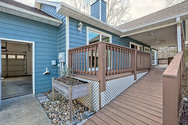 wooden deck featuring ceiling fan