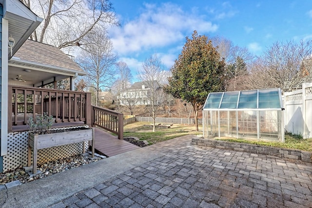 exterior space with an outbuilding and a deck