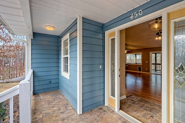 doorway to property featuring covered porch