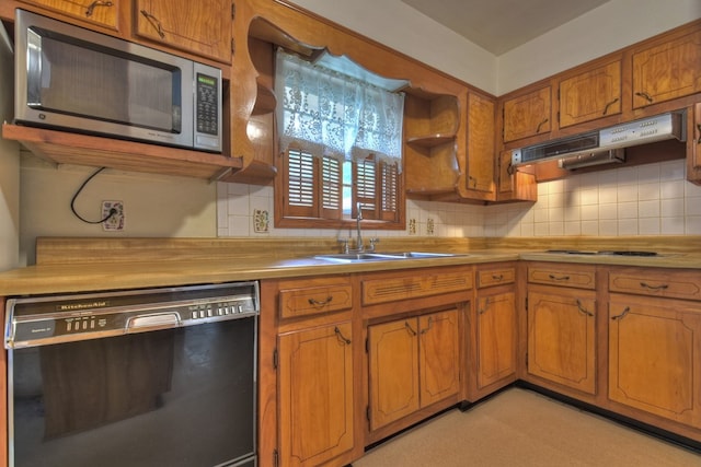 kitchen with dishwasher, white gas cooktop, sink, and tasteful backsplash