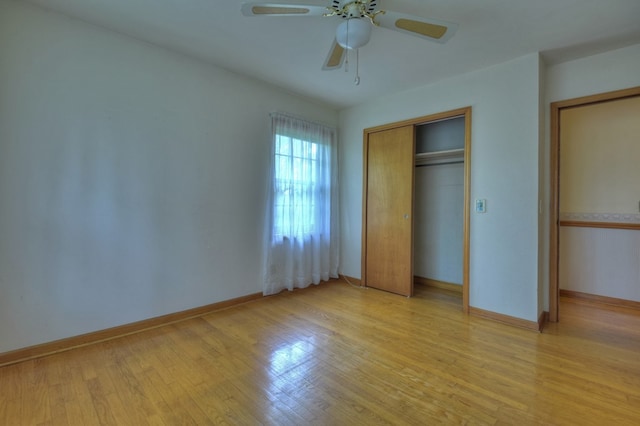 unfurnished bedroom with a closet, ceiling fan, and light hardwood / wood-style flooring