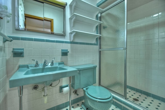 bathroom featuring walk in shower, tasteful backsplash, tile patterned floors, toilet, and tile walls