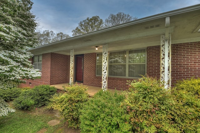 view of exterior entry featuring a porch