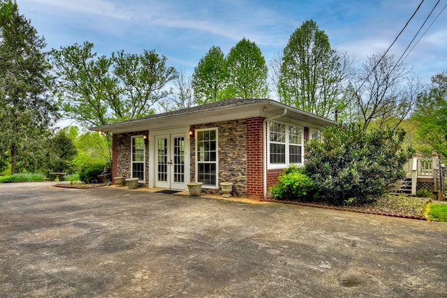 view of side of property featuring french doors