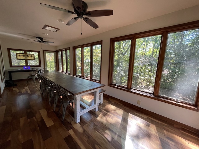 dining space with dark hardwood / wood-style floors