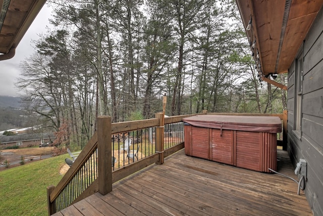 wooden terrace with a hot tub