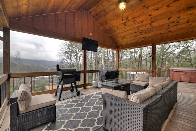 sunroom / solarium featuring lofted ceiling and wood ceiling