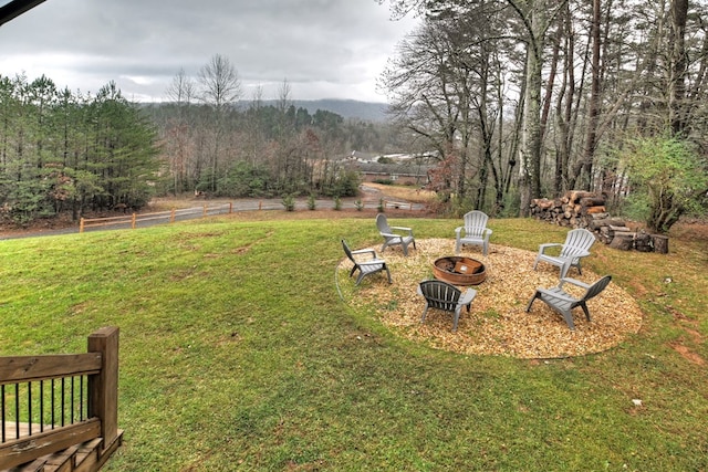 view of yard with a fire pit