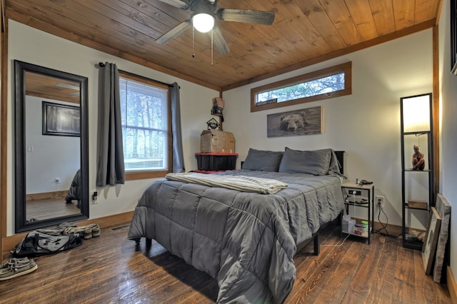 bedroom with ceiling fan, dark hardwood / wood-style floors, wooden ceiling, and ornamental molding