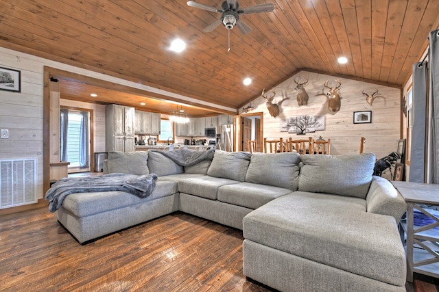 living room with wood ceiling, ceiling fan, dark wood-type flooring, wooden walls, and lofted ceiling